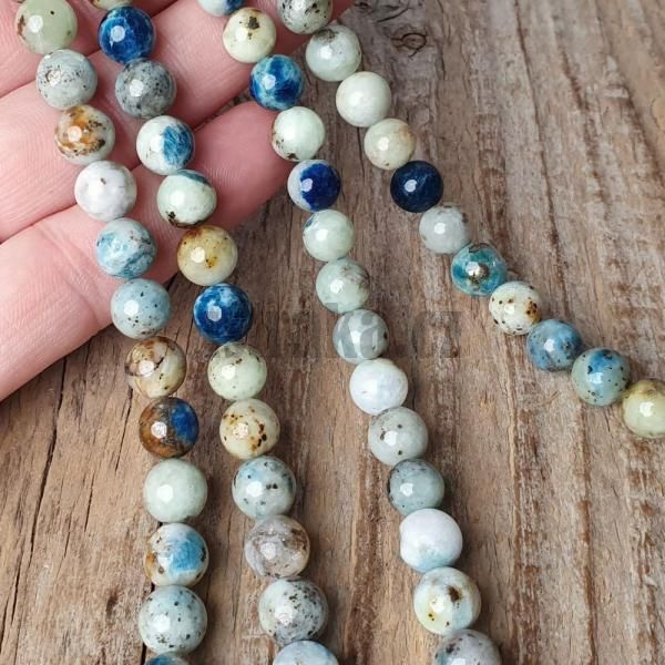 koralky-z-prirodneho-mineralu-hackmanit-hakmanit-8mm-strakate-farebne-modre-mentolove-