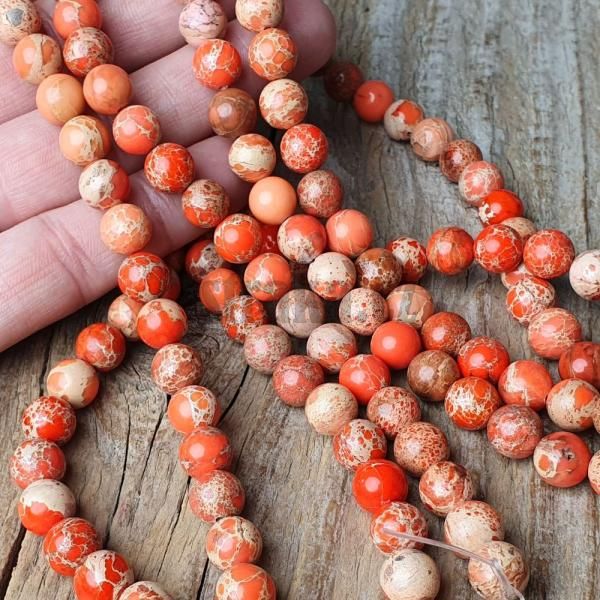 koralky-jaspis-regalit-oranzove-vyrazne-pomarancove-s-bezovou-kresbou-8mm-gulate-leskle-mr
